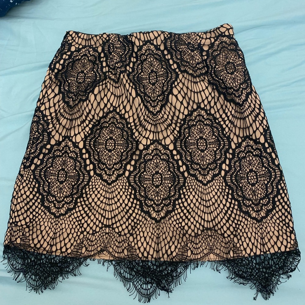 nude and black lace mini skirt